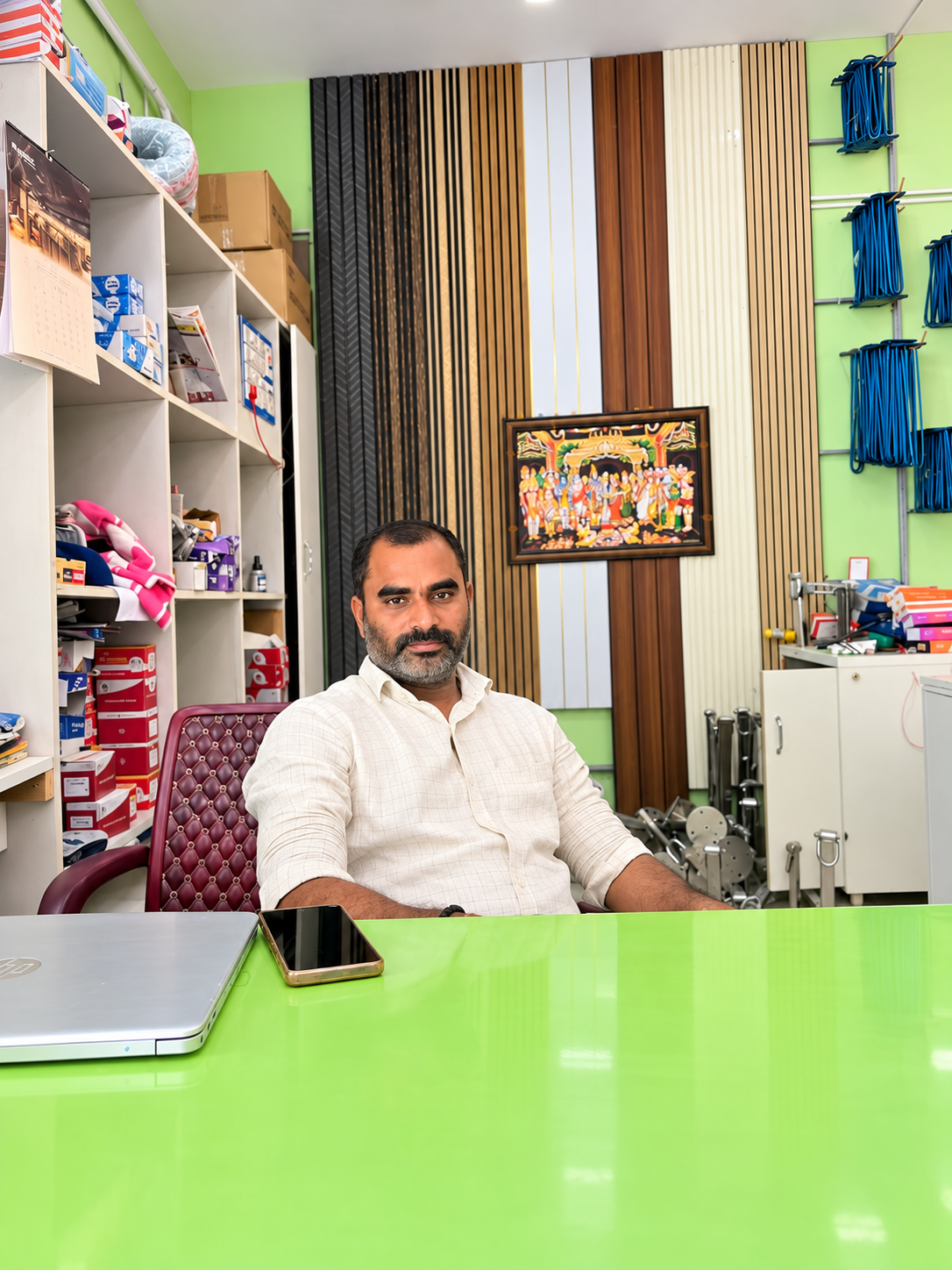 Y. Ramamohan Reddy seated at the shop counter